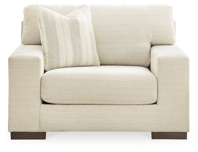 Ashley Furniture Maggie oversized chair with plush fabric, wide seating, and supportive armrests, shown from a front head-on view.