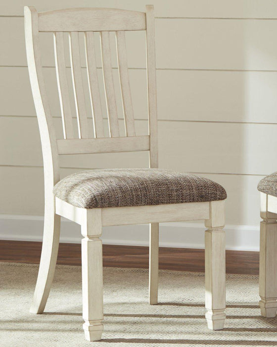 Ashley Bolanburg dining room set with a wooden table and matching chairs, ideal for a modern dining space.