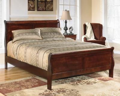 Ashley Furniture Alisdair Bed with a sturdy wooden frame and stylish design, shown in a cozy bedroom setting.