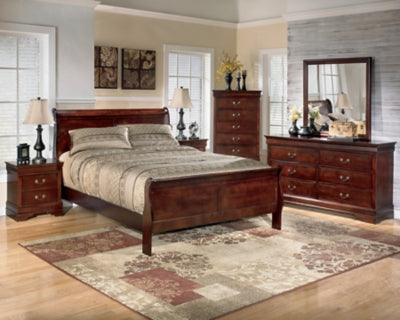 Ashley Furniture Alisdair Bed with a sturdy wooden frame and elegant design, shown in a stylish bedroom setting.