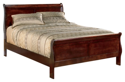 Ashley Furniture Alisdair Bed with a wooden frame and upholstered headboard, shown in a modern bedroom setting.