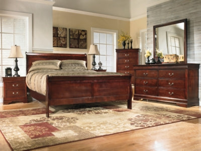Ashley Furniture Alisdair Bed with a sturdy wooden frame and stylish headboard, shown in a cozy bedroom setting.