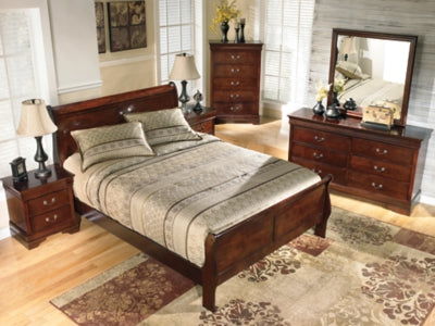 Ashley Furniture Alisdair Bed with dark wood finish and elegant headboard, showcasing a stylish and sturdy bedroom centerpiece.