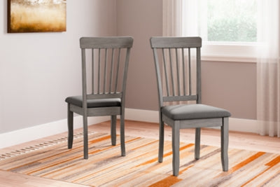 Ashley Furniture Shullden dining room set with a wooden table and matching chairs, elegant and ready for family meals.