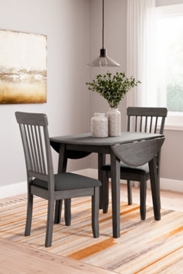 Ashley Furniture Shullden dining room set with a table and matching chairs, ideal for a modern dining space.
