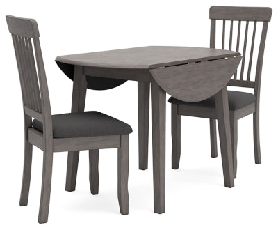 Ashley Furniture Shullden dining room set with a wooden table and matching chairs, shown in a modern dining space.