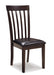 Ashley Furniture Hammis dining chair set featuring four upholstered wooden chairs with a modern design.