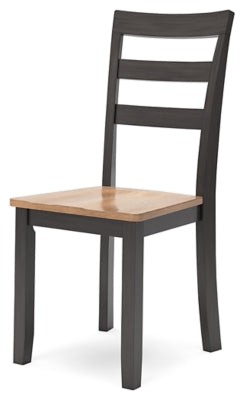 Ashley Furniture Gesthaven dining room set with a wooden table and matching chairs, shown from an angled view.