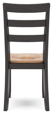 Ashley Furniture Gesthaven dining room set with a wooden table and six matching chairs, shown from the back view.