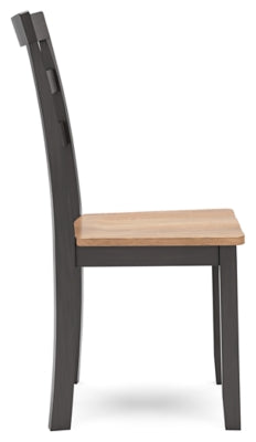 Ashley Furniture Gesthaven dining room set with a wooden table and matching chairs, shown in a side view.