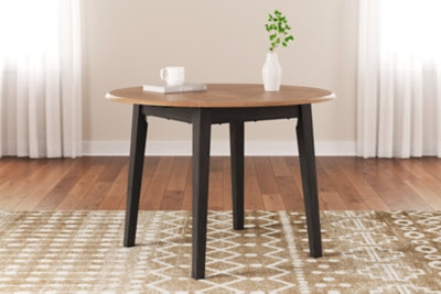 Ashley Furniture Gesthaven dining room set with a wooden table and six upholstered chairs, perfect for elegant dining spaces.