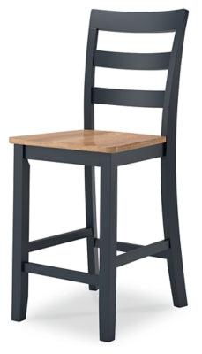 Ashley Furniture Gesthaven dining room set with a wooden table and upholstered chairs, shown from an angled view.