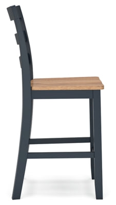 Ashley Furniture Gesthaven dining room set with a wooden table and six matching chairs, shown in a well-lit dining room setting.