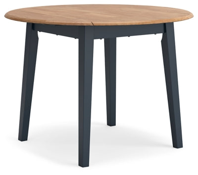 Ashley Furniture Gesthaven dining room set with a wooden table and matching chairs, shown from an angled side view.