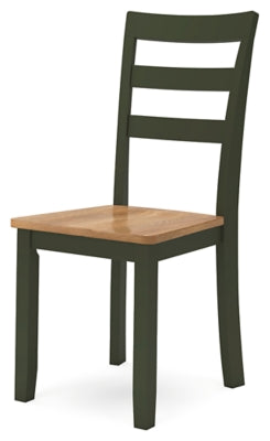Ashley Furniture Gesthaven dining room set with a wooden table and matching chairs, shown from an angled view.