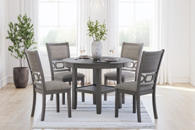 Ashley Furniture Wrenning dining table with 4 matching chairs in a stylish dining room set, showcasing wood finish and modern design.