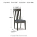 Ashley Furniture Hallanden dining chair with a wooden frame and upholstered seat, showcasing a modern and stylish design.