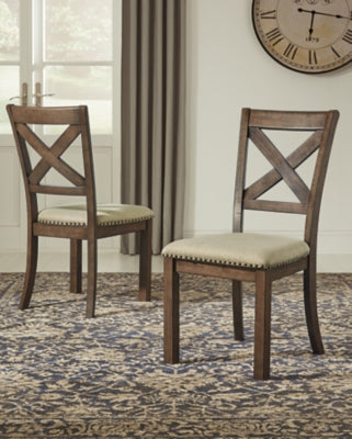 Ashley Furniture Moriville counter height dining set with a wooden table and matching chairs in a modern dining room setting.