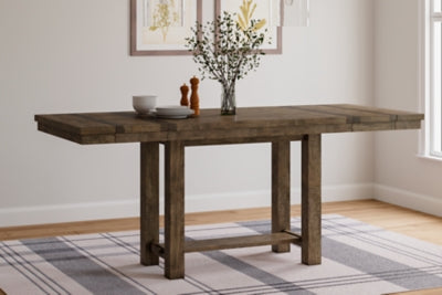 Ashley Furniture Moriville counter height dining set with four chairs and a rectangular table in a warm wood finish.