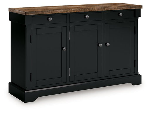Ashley Furniture Wildenauer dining buffet shown from an angle, featuring a sleek wooden design with closed cabinet doors.