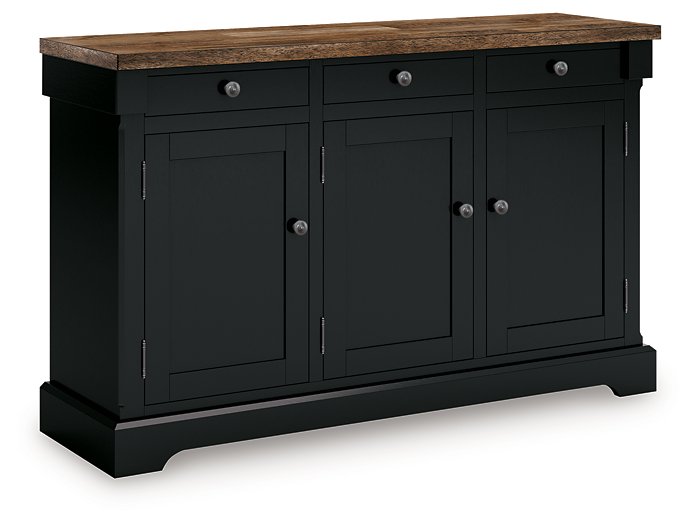 Ashley Furniture Wildenauer dining buffet shown from an angle, featuring a sleek wooden design with closed cabinet doors.