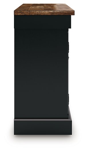 Ashley Furniture Wildenauer dining buffet with a sleek wooden finish, featuring multiple storage compartments and a modern design.