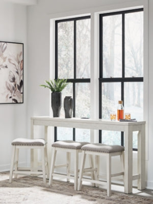 Ashley Furniture Robbinsdale counter height dining table with three matching barstools, featuring a modern wooden design.