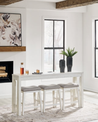 Ashley Furniture Robbinsdale counter height dining table with three matching barstools, featuring a modern wood finish and sturdy design.