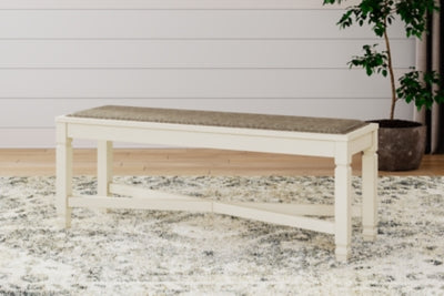 Ashley Furniture Bolanburg dining room set with a table and chairs in an elegant design, shown in a warm wood finish.