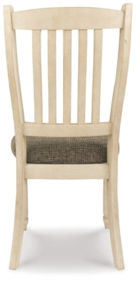 Ashley Furniture Bolanburg dining set with a rectangular table and six upholstered chairs in a modern dining room setting.