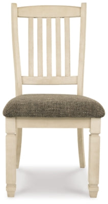Ashley Furniture Bolanburg dining room set with a wood table and six upholstered chairs, shown from head-on perspective.
