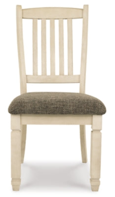 Ashley Furniture Bolanburg dining room set with a rectangular table and six upholstered chairs, shown from a head-on angle.