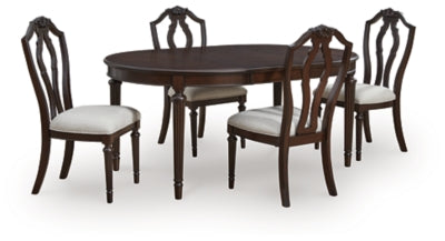 Ashley Furniture Lavinton Dining Room Set with a wooden table and matching chairs in a modern, stylish dining space.