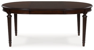Ashley Furniture Lavinton dining room set with rectangular table, six upholstered chairs, and leaf extension in a modern dining room setting.
