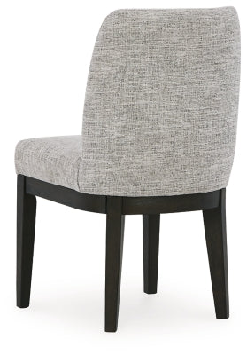 Ashley Furniture Burkhaus dining room set with a table and chairs, shown from the back view in a modern dining space.