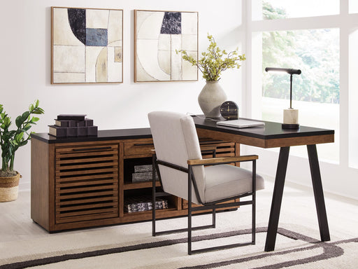 Ashley Furniture Kallari credenza desk with return, featuring wood finish and modern design, shown in a close-up of the desk and storage area.