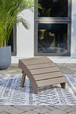 Outdoor Sundown Treasure Ottoman by Ashley Furniture, featuring woven rattan design and plush cushioned top for outdoor lounging.