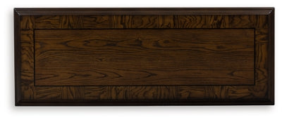 Ashley Furniture Maylee Sofa Table with sleek wooden top and modern design, perfect for living room decor.