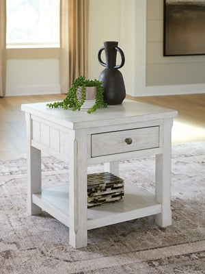 Ashley Furniture Robbinsdale End Table with a dark wood finish and sleek, modern design, shown in a close-up view.